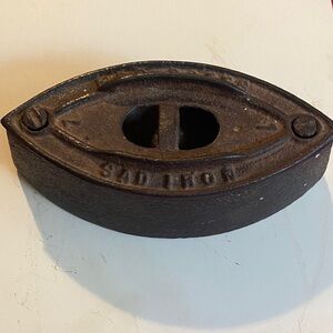 Antique Mrs. Pottr Sad Iron Doorstop
